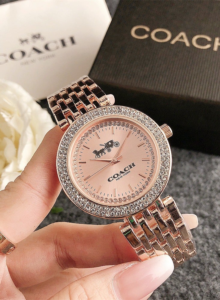 ساعة كوتش للسيدات لون ذهبي وردي مع إطار كريستالي وسوار ستانلس ستيل